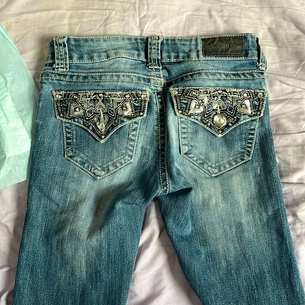 A pair of Zco Jeans